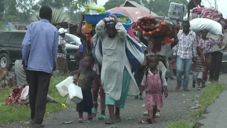 Congolese city Goma under threat as thousands flee rebel advance.