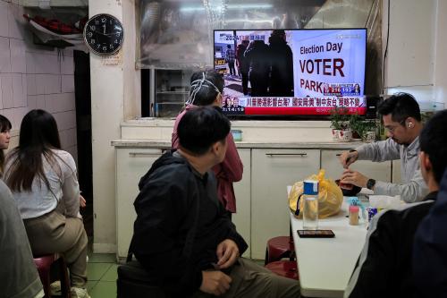 People watch the live broadcast of the U.S. election on the morning news at a restaurant in Taipei, Taiwan, November 6, 2024.