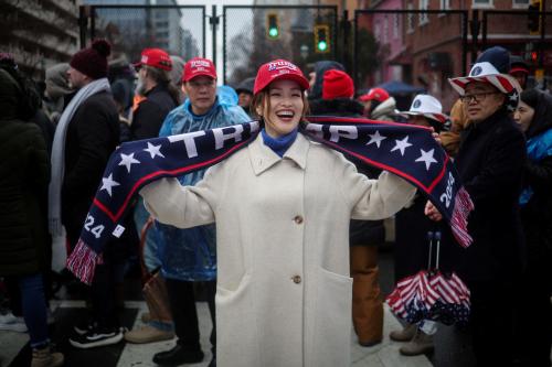 Grace Sun, from Shenzhen China, poses for a picture outside Capital One Arena, ahead of a rally for U.S. President-elect Donald Trump the day before he is scheduled to be inaugurated for a second term, in Washington, U.S., January 19, 2025.