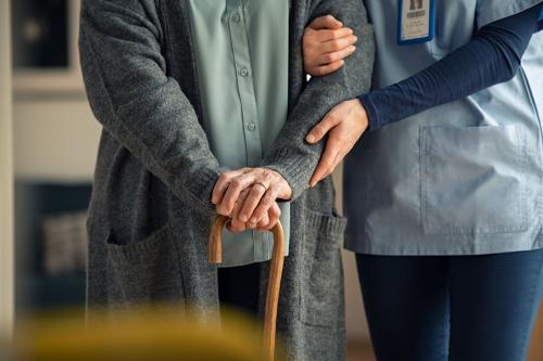 Nurse helping older woman